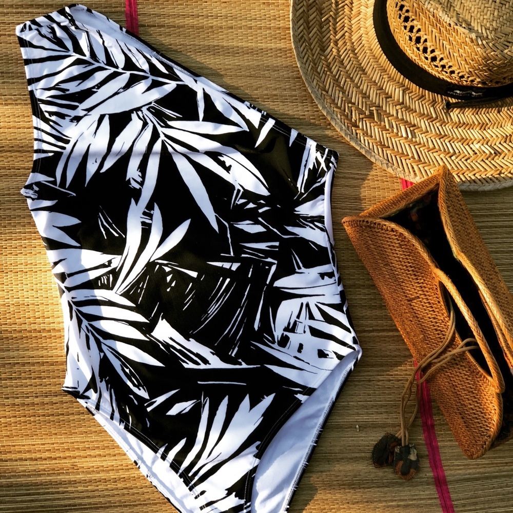 Half shoulder one piece bathing suit.